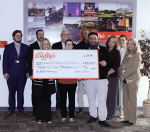 Bally's and CDHFH executives pose with the donation check.